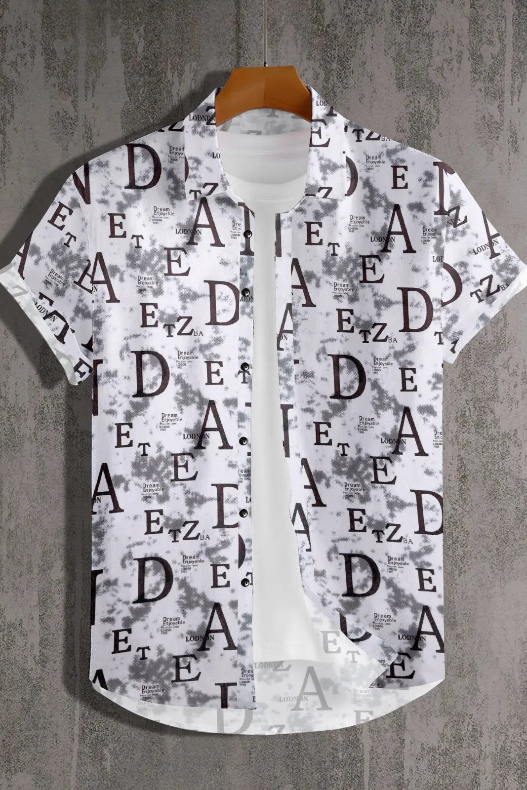 Short-sleeve shirt with letter pattern on a textured gray background