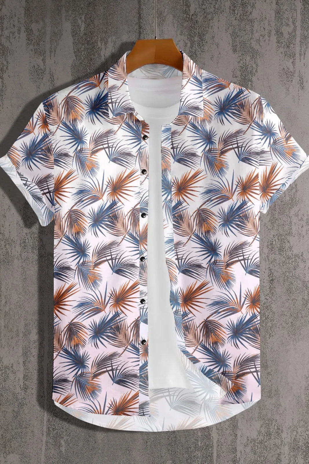 Short-sleeve shirt with tropical leaf pattern on a textured gray background