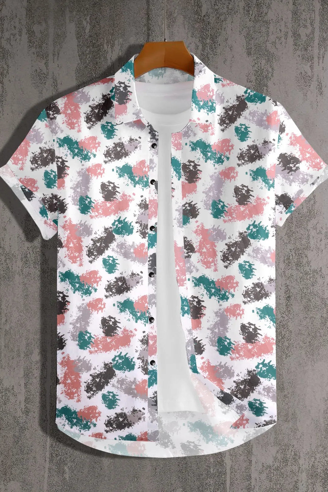Short-sleeve shirt with colorful abstract pattern on a textured gray background