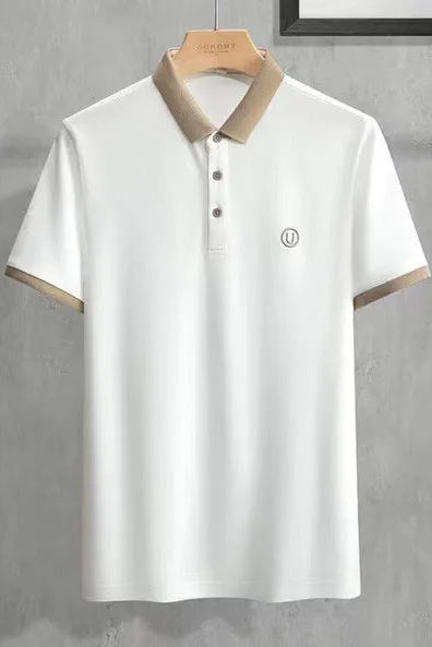 White polo shirt with brown trim on a gray background