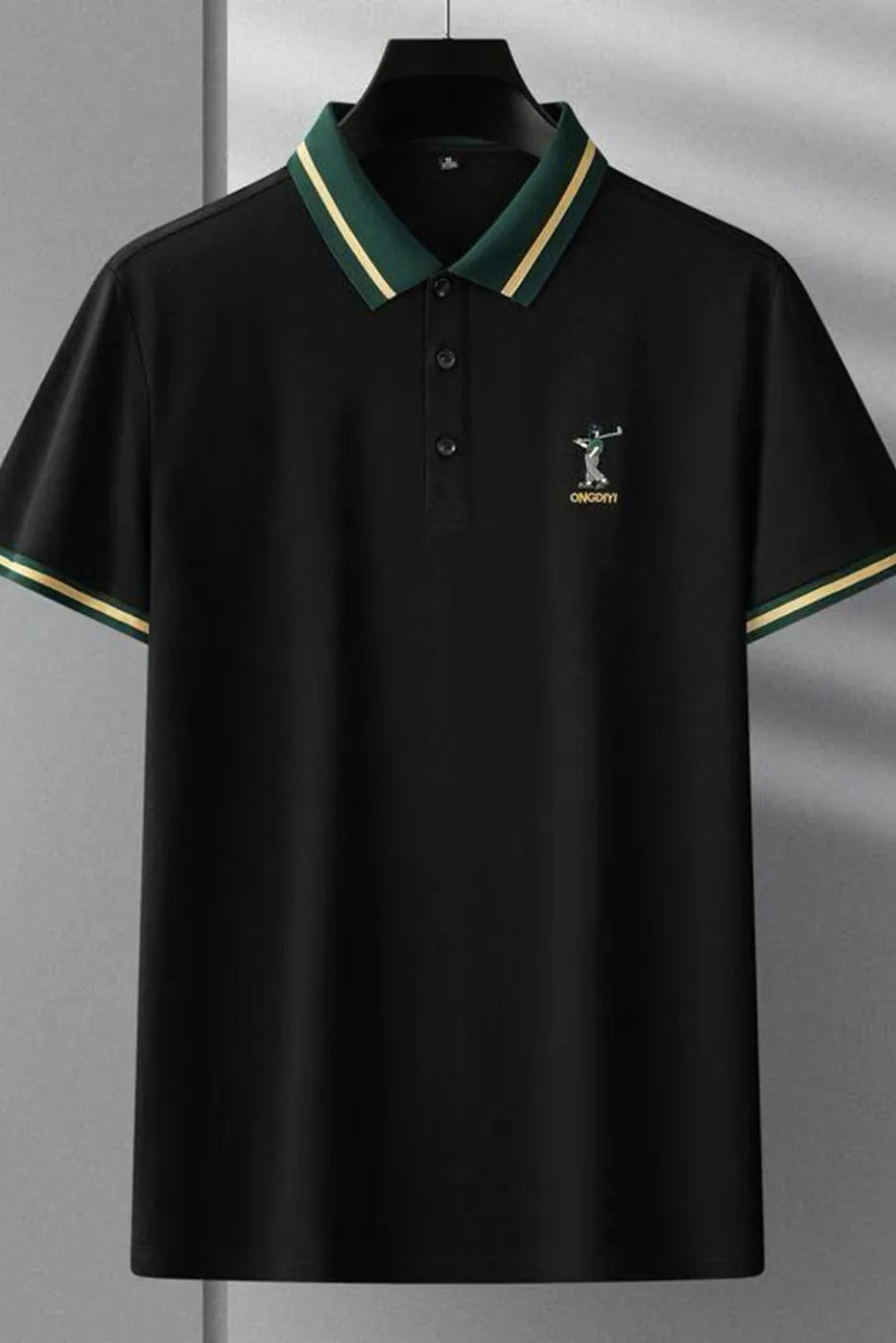 Black polo shirt with green trim and a logo on a gray background