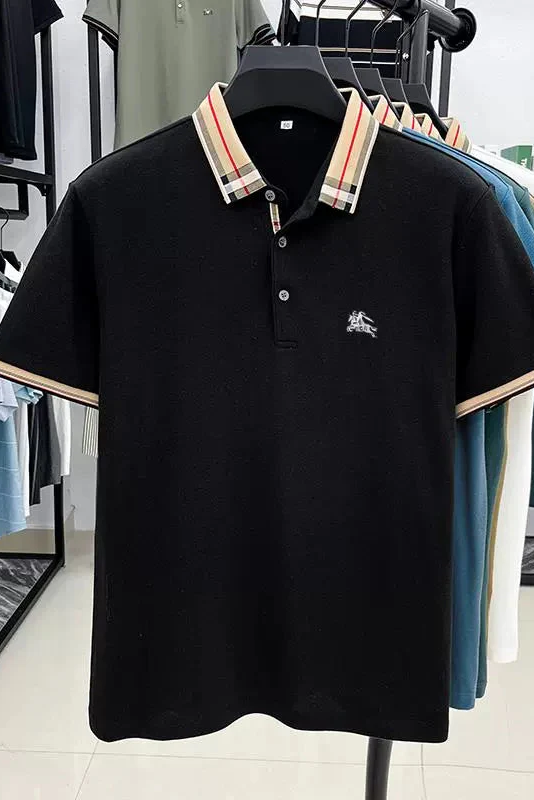 Black polo shirt with plaid collar hanging in a store