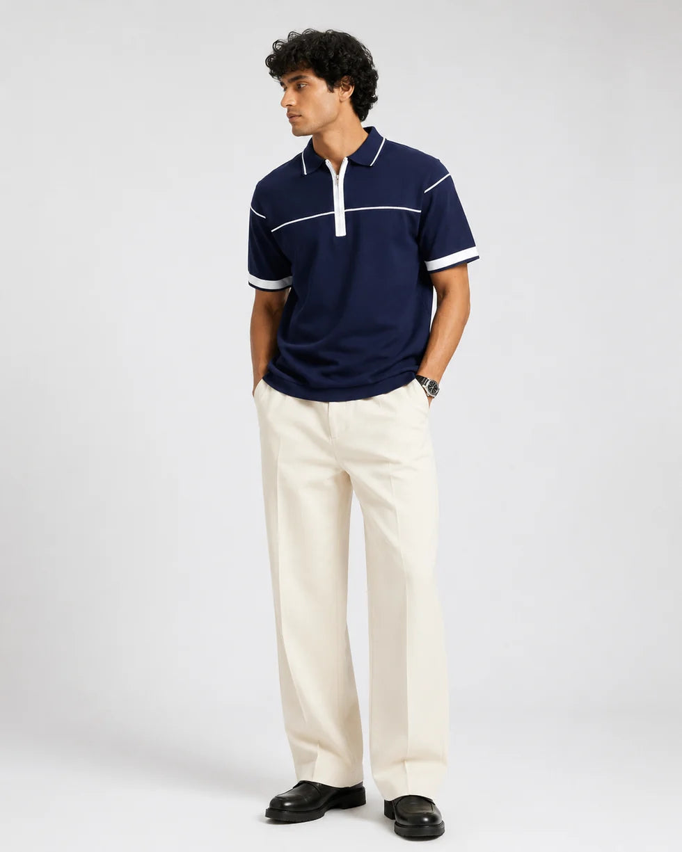 Full-length front view of a model wearing the navy and white horizontal contrast piping polo
