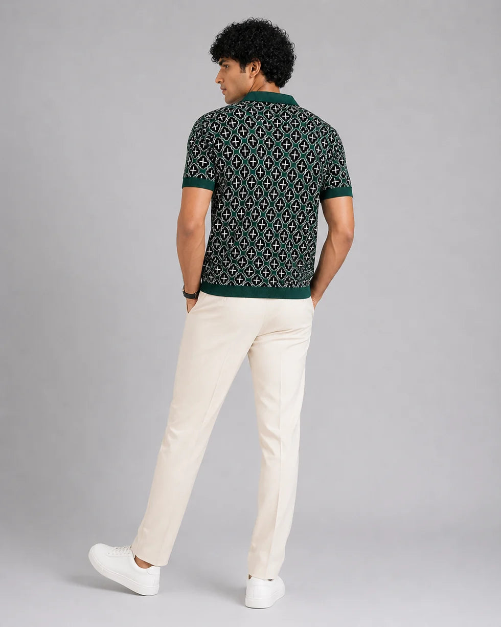 Back view of the deep teal green and white mosaic geometric jacquard polo and its short sleeves