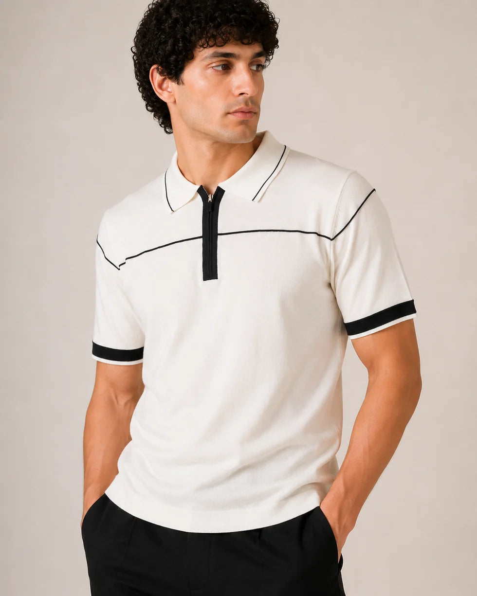 Front view of an off-white knit zip polo with deep green collar tipping, chest piping and sleeve cuffs