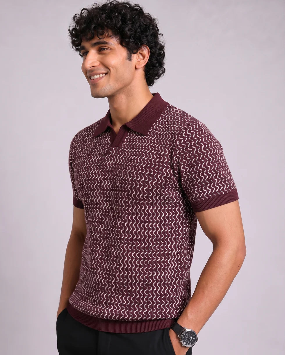 Close front view of the wine and cream zigzag wave jacquard polo showing its open johnny collar