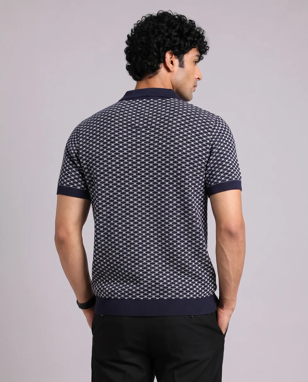 Back view of the navy and white small-scale geometric jacquard polo
