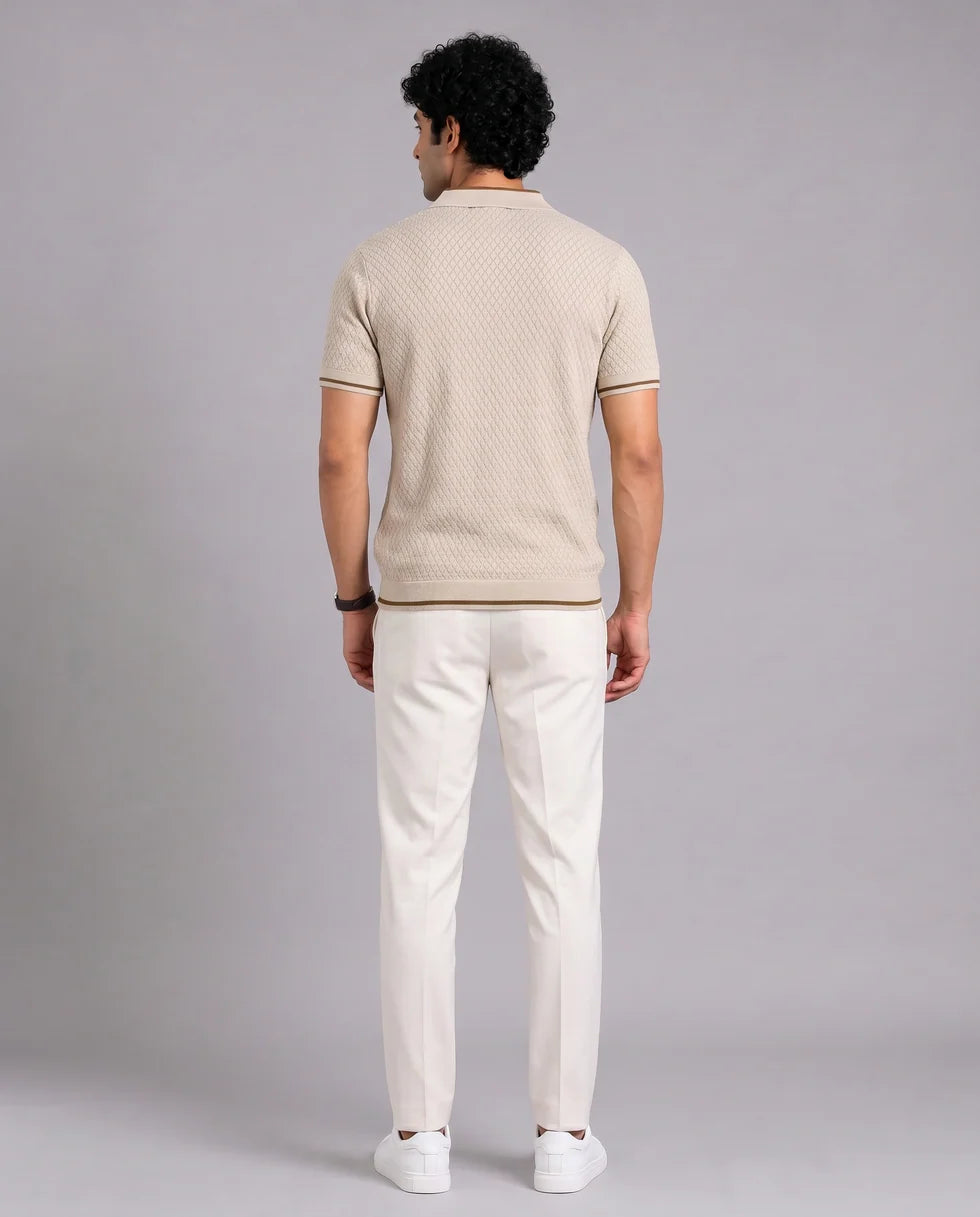 Back view of the sandstone diamond jacquard polo and its short sleeves