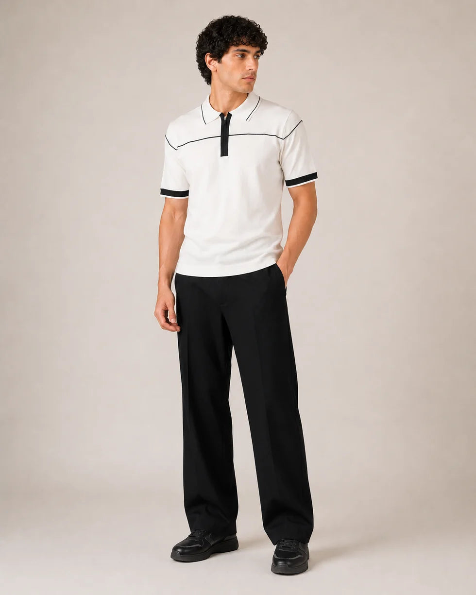 Full-length front view of the off-white contrast piping zip polo styled with black trousers
