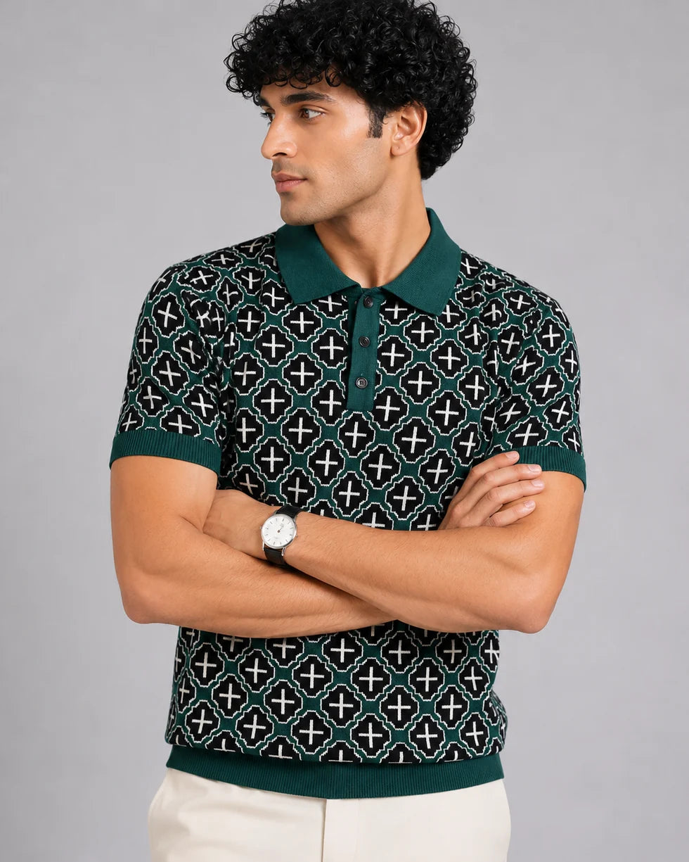 Close front view of the deep teal green and white mosaic geometric jacquard polo showing its polo collar with button placket