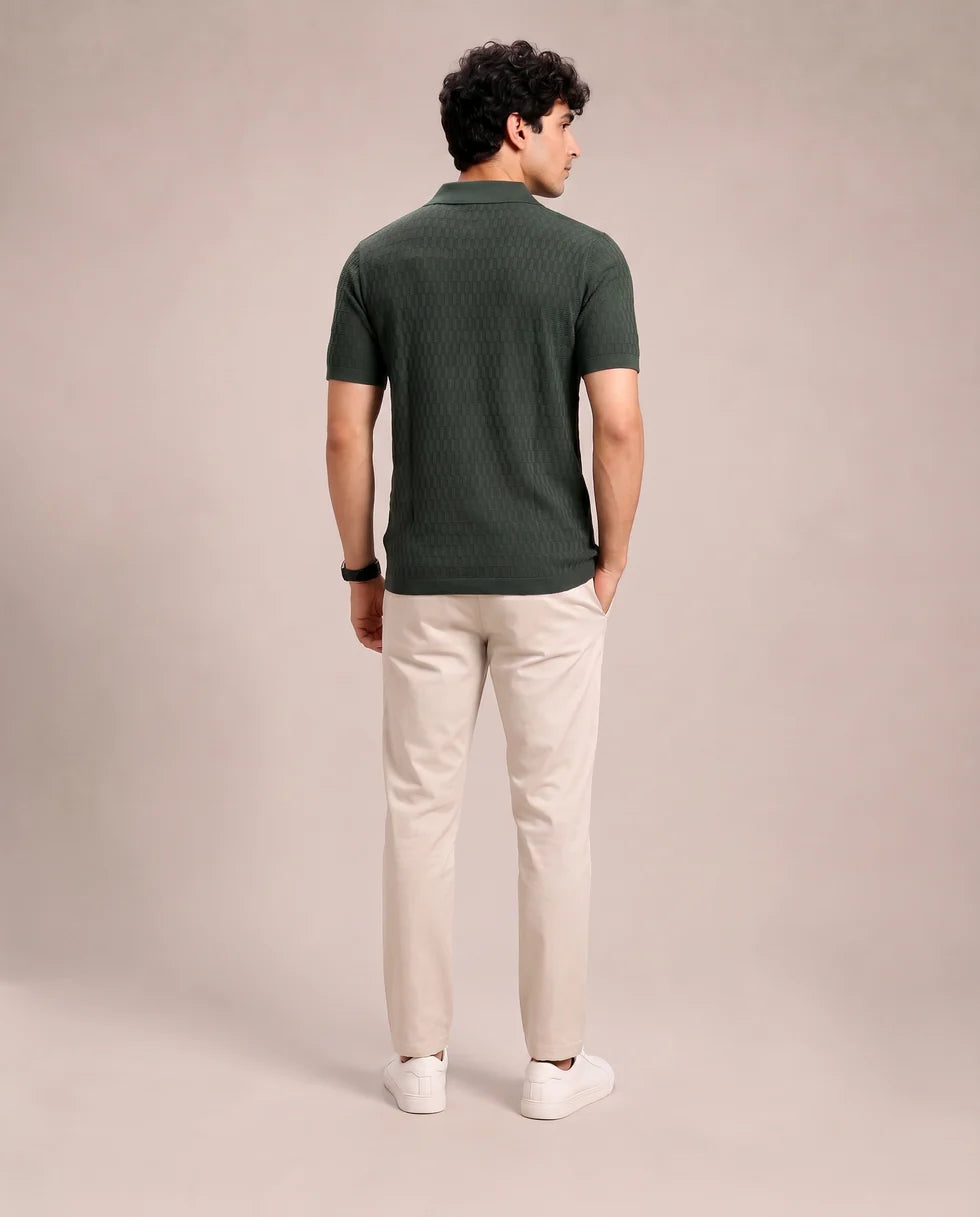Back view of the emerald green tonal textured knit polo and its short sleeves