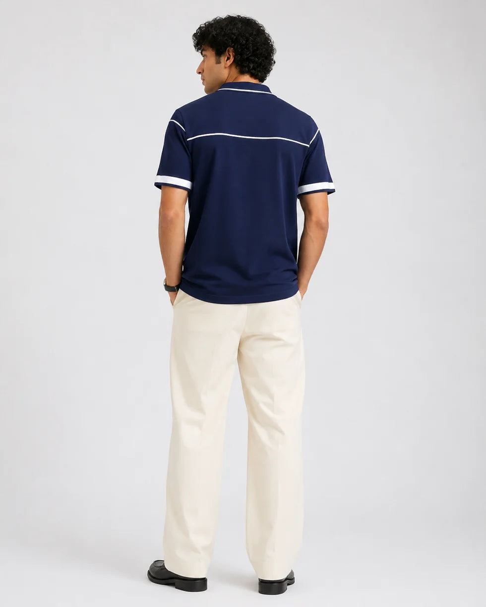 Back view of the navy and white horizontal contrast piping polo and its short sleeves