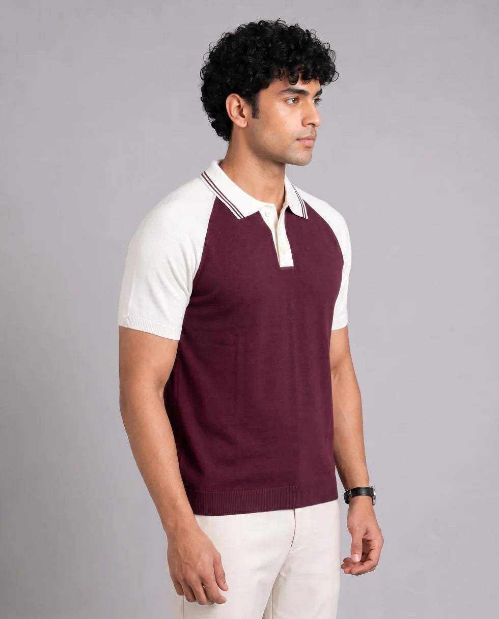 Close front view of the maroon and white colourblock knit polo showing its polo collar with button placket