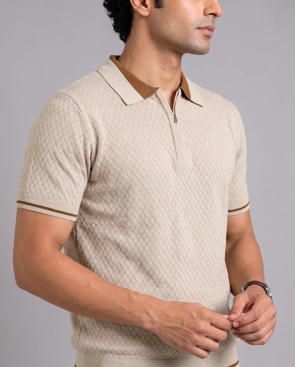 Close front view of the sandstone diamond jacquard polo showing its polo collar with zip placket
