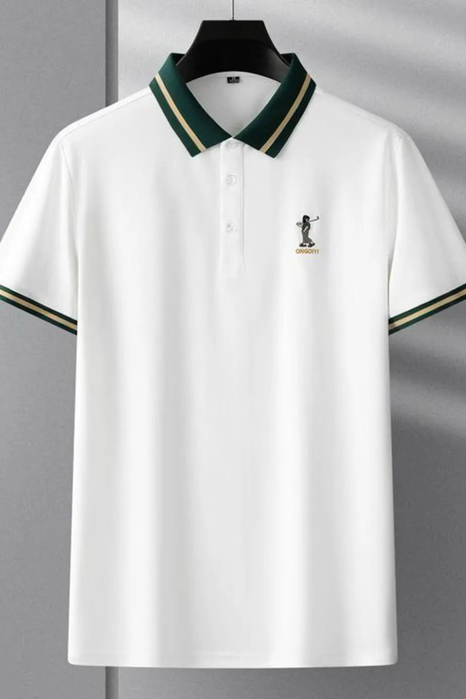 White polo shirt with green and gold accents on a gray background